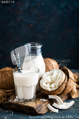 Image of Fresh coconut milk in glass bottle, vegan non dairy healthy drin