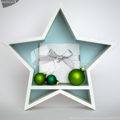 Image of Christmas decoration white star with glass balls inside