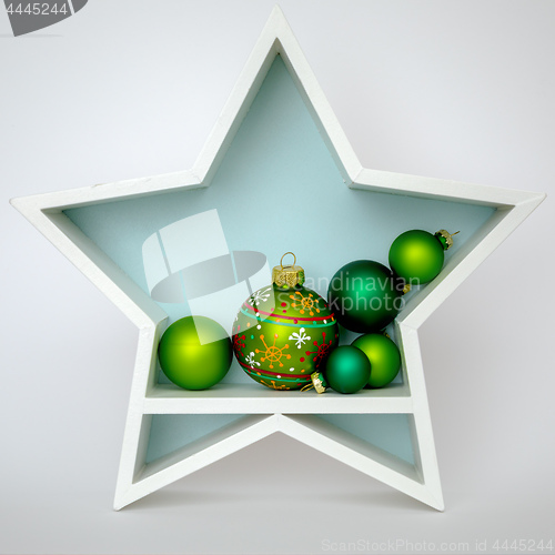 Image of Christmas decoration white star with glass balls inside