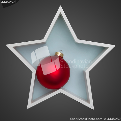 Image of Christmas decoration white star with red glass ball inside