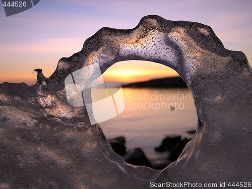 Image of Sunset through ice's hole