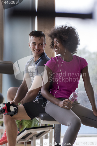 Image of couple in a gym have break