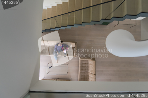 Image of mother and her cute little daughter are using a tablet top view