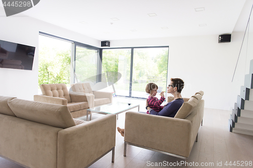 Image of mother and cute little girl enjoying their free time