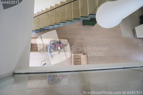 Image of mother and her cute little daughter are using a tablet top view