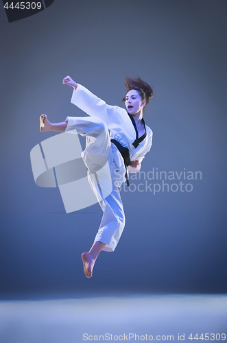 Image of The karate girl with black belt