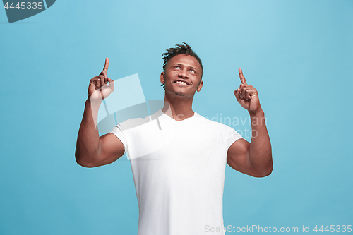 Image of Winning success afro-american man happy ecstatic celebrating being a winner. Dynamic energetic image of male model