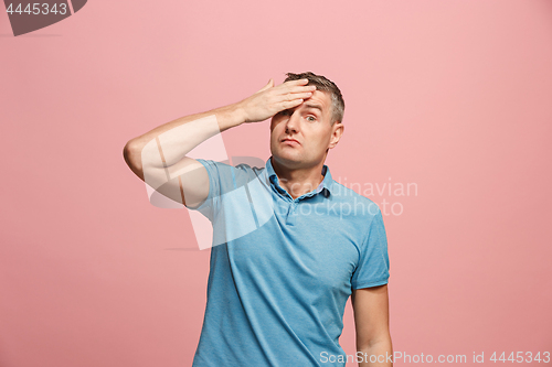 Image of Young serious thoughtful businessman. Doubt concept.