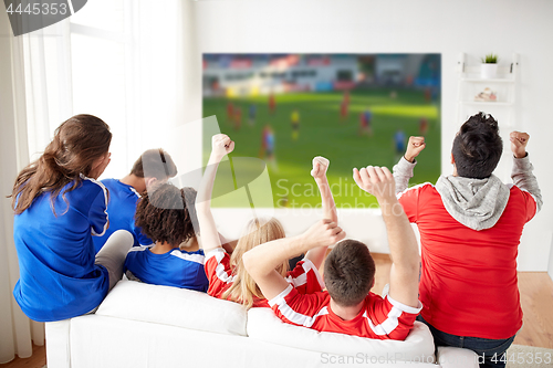 Image of friends or football fans watching soccer