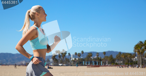 Image of woman with fitness tracker running