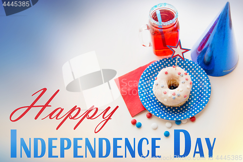 Image of donut with juice and candies on independence day