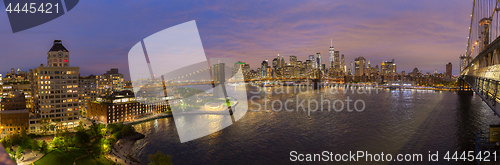 Image of Brooklyn Bridge and Lower Manhattan skyline at night, New York city, USA.