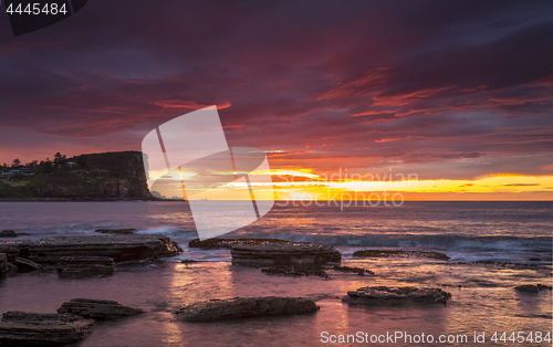 Image of Coastal sunrise red skies