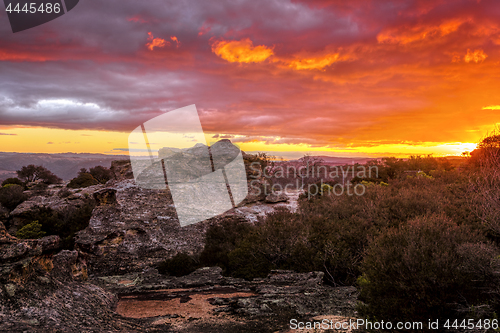 Image of Sunset skies looking across the cliff to the distant mountains