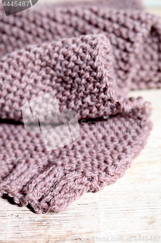 Image of Knitted brown scarf.