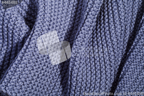 Image of Blue wool knitted scarf.