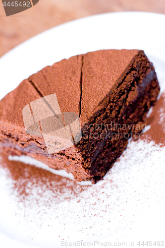 Image of Piece of chocolate cake on white plate.