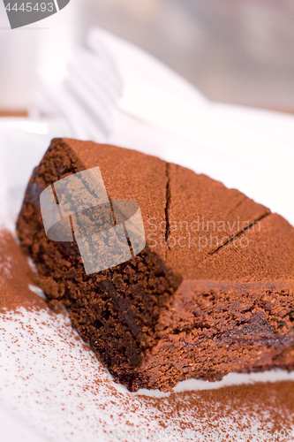 Image of Piece of chocolate cake on white plate.