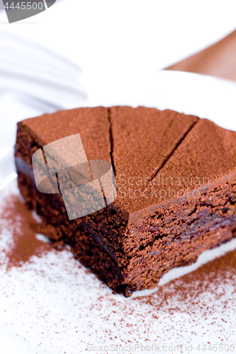 Image of Piece of chocolate cake on white plate.