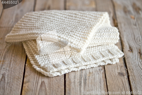 Image of Hand knitted white scarf.