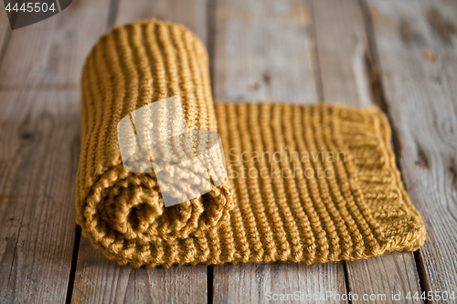 Image of Hand knitted yellow scarf.