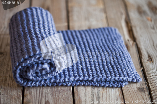 Image of Hand knitted blue scarf.