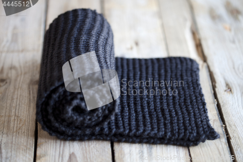 Image of Hand knitted black scarf.