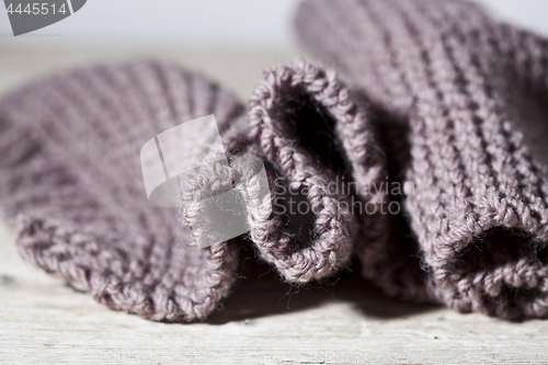 Image of Knitted brown scarf.