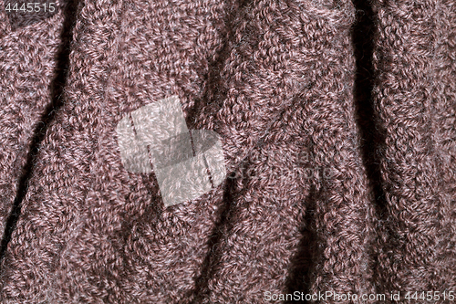 Image of Knitted brown scarf texture.