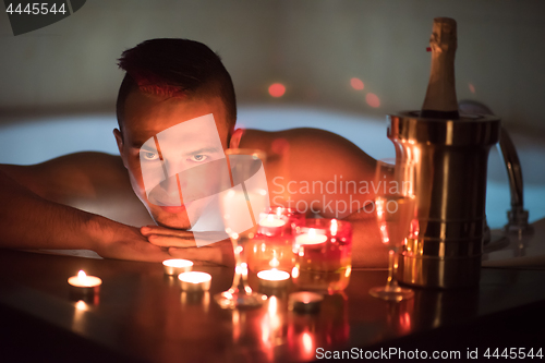 Image of man relaxing in the jacuzzi