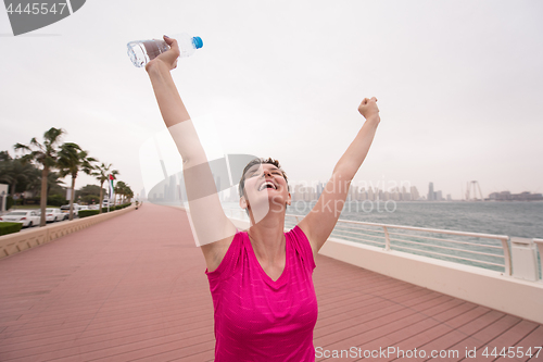 Image of young woman celebrating a successful training run