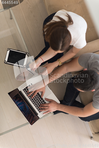 Image of happy young couple buying online