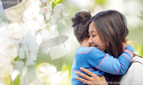 Image of happy mother and daughter hugging