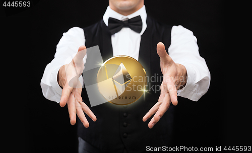 Image of close up of magician with ethereum coin