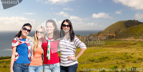 Image of teenage girls or young women over big sur coast