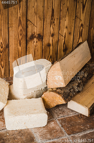 Image of Wood briquette and firewood, close-up