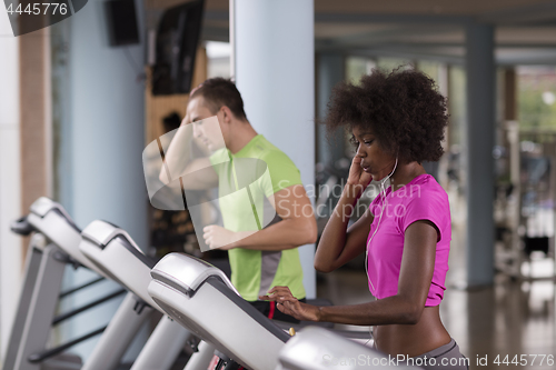 Image of people exercisinng a cardio on treadmill