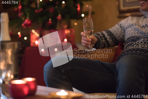 Image of Happy young man with a glass of champagne