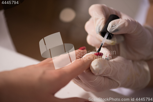 Image of Woman hands receiving a manicure
