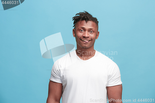 Image of The squint eyed afro-american man with weird expression isolated on pink