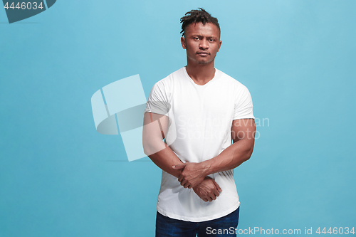 Image of Beautiful afro-american man looking suprised and bewildered isolated on pink