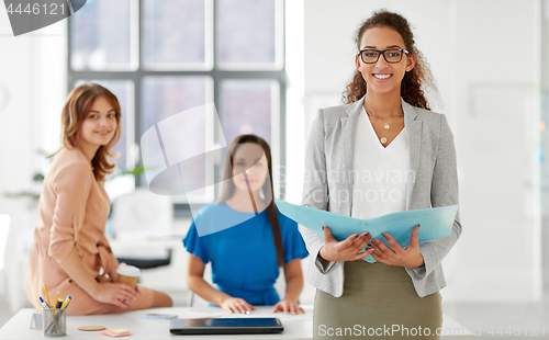 Image of businesswomen at presentation in office