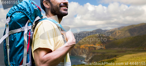 Image of close up of man with backpack on big sur coast