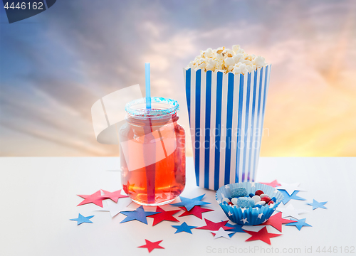 Image of drink and popcorn with candies on independence day