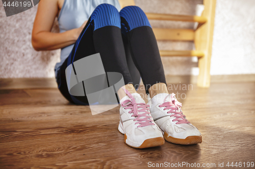 Image of Sport shoes of tired girl