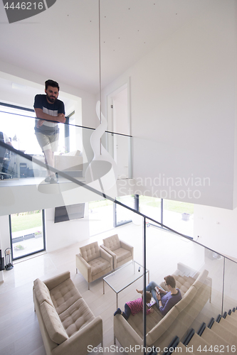 Image of family with little girl enjoys in the modern living room