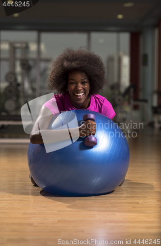 Image of woman  relaxing after pilates workout