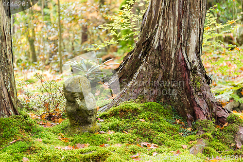 Image of Adorable statue in Japanese temple in autumn