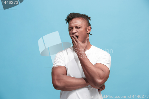 Image of Beautiful bored faro-american man bored isolated on blue background