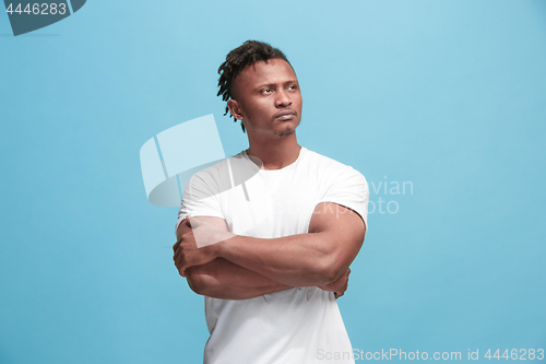 Image of Young serious thoughtful Afro-American businessman. Doubt concept.